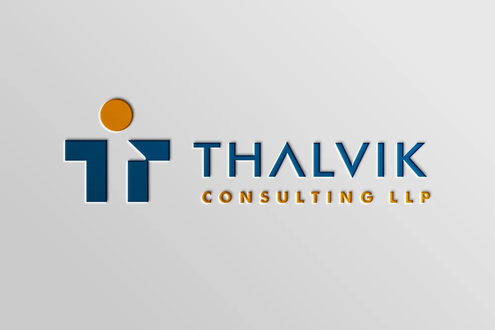 Thalvik Consulting LLP logo embossed on a grey wall
